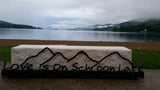 Love is in the Schroon Lake text on the base with the outline of the Adirondack mountains cut out.