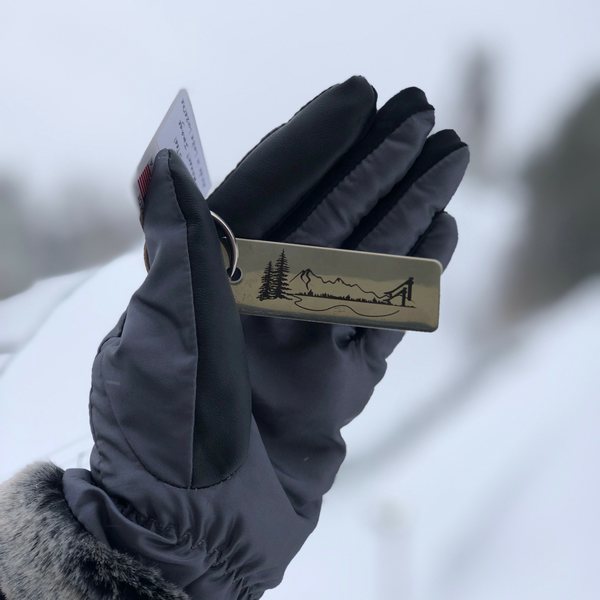 The iconic Whiteface Mountain and the Lake Placid Ski Jump are artistically intertwined on a stainless steel key tag.