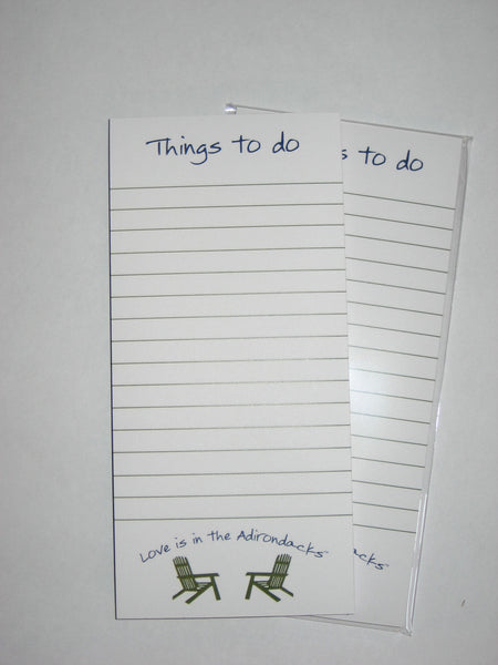 Things to do notepad text on top of each sheet with Love is in the Adirondacks arched over two opposing Adirondack Chairs.