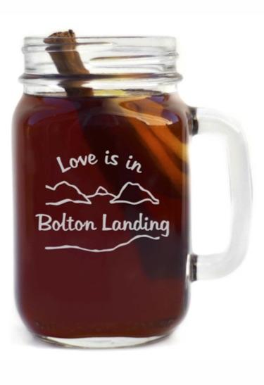 Glass handled mason jar with our lake and mountain graphic. Love is in Bolton Landing is the text.