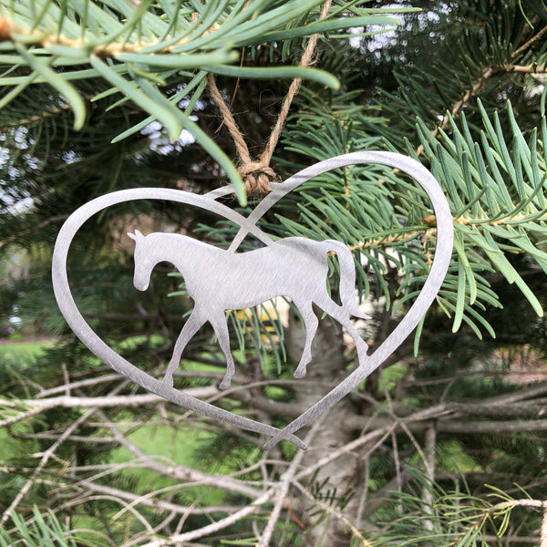 Heart Ornament with a Horse inside the heart hung with a hand tied twine hanger. Made of stainless steel.