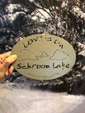 Love is on Schroon Lake text with the outline of the lake and surrounding Adirondack mountainscape