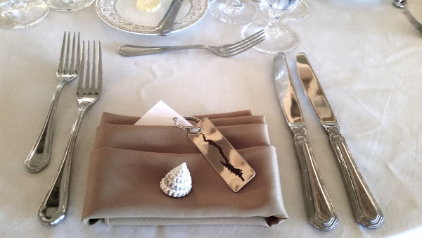 Key ring used as a wedding favor on a napkin