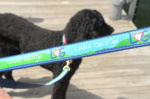 Dog leash with interlocking LheartG logo in between Lake George on a ribbon with nylon webbing on the other side of the dog leash