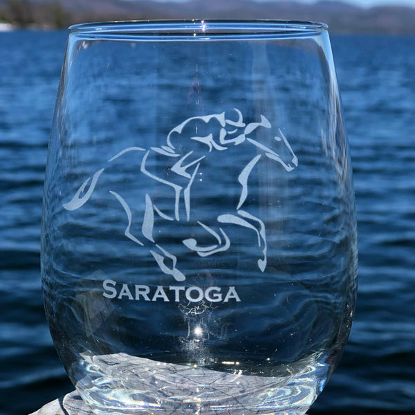 Jockey riding a horse with the text Saratoga on a Stemless wine glass.