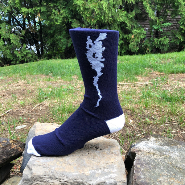 Silhouette of Lake Champlain stitched in white on a navy blue crew length sock.