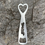 Silhouette of Friends Lake cut out on a stainless bottle opener.