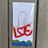 Things to do at the Lake Notepad paired with a red metal LG heart ornament.