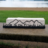 Love is on Friends Lake text on the base with the outline of the Adirondack mountains cut out.