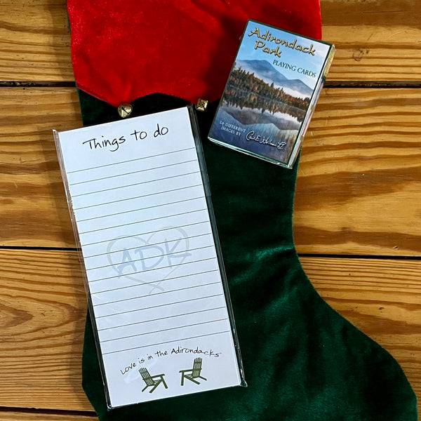 Things to do ADK notepad paired with a deck of Carl Heilman Adirondack playing cards.