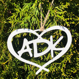 ADK in a heart metal ornament with a natural hemp hand tied hanger; color white