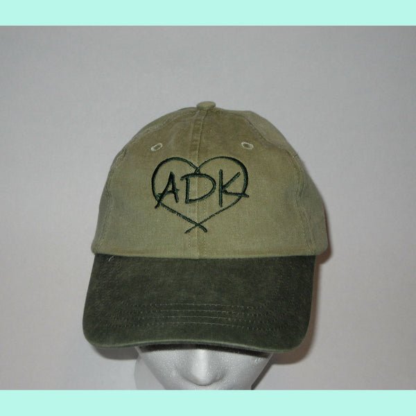 Ball cap with our ADK in a heart silhouette logo.  Two toned. ADK in a heart silhouette is embroidered in green thread to complement the beak of the ball cap.