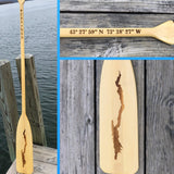 Silhouette of Lake George Laser Etched in the natural word of this canoe oar.  The house coordinates etched on the oar handle. 