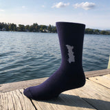 Silhouette of Friends Lake stitched in white on a unisex navy blue sock.