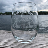 Love is on Glen Lake Sandblasted on a stemless wine glass with a lake and mountain scene.