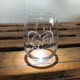 Clear stemless wine glass with our GF logo inside a heart. 