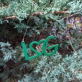Christmas ornament with the letters LG connected with an interlocking heart and a metal hanger.; color green.
