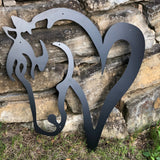 Black metal wall mount of a horse head connected to a heart.