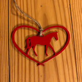Red metal Horse in a heart ornament with brown rope hanger.
