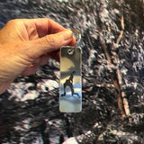The silhouette of Loon Lake etched using a permeable process on a stainless key chain.