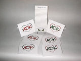 Adirondacks note cards have our interlocking Love is in the Adirondacks ADK Heart silhouette in alternating colors; red/green.Our ADK Things to do notepad is shown in this picture too.