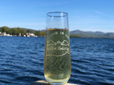 Love is on Lake George text sand blasted on a stemless champagne flute with the Lake and mountain outline.