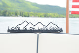 Love is on Lake George text on a metal sign with the cutout of the Mountains; graphite.
