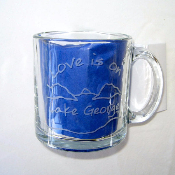 Love is on Lake George text with the outline of the lake and surrounding Adirondack mountains