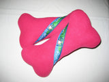 Dog bone shaped squeaky toy with Lake George text nestled in between our LG interlocking heart design. Color shown is pink