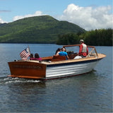 Photo of a 26' Lyman wooden boat with people riding in it, on Lake George.