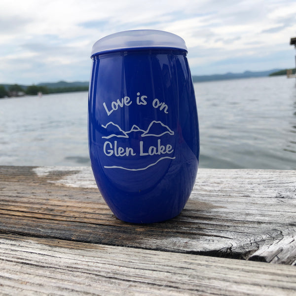 Love is on Glen Lake Text in white on a blue plastic cup with the lake and mountain scene.