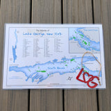 The Islands of Lake George laminated placemat and a red LheartG ornament.