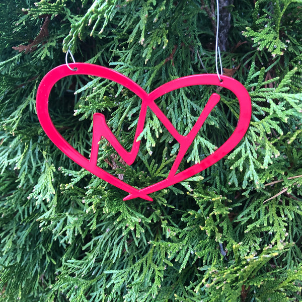 Metal New York Ornament with NY inside a heart. Metal wire hanger; color gold haze