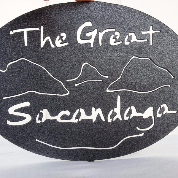 Text The Great Sacandaga with the outline of the lake and surrounding Adirondack mountains