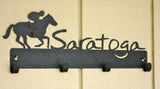 Jockey riding a race horse next to the word Saratoga.