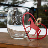 Stemless wine glass with a jockey riding a horse sandblasted on it with a Red Horse in a heart metal ornament hung with twine.. This is a two-piece gift package