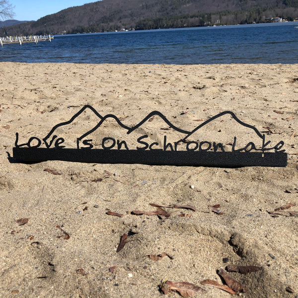 Love is on Schroon Lake text on Black Metal shelf sitter with the mountains.
