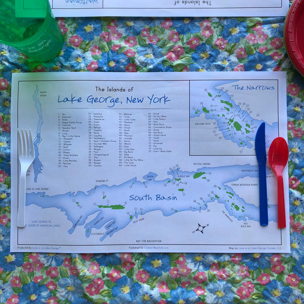 Disposable placemat including a map of the Islands of Lake George  including some fun facts. One-sided; white background, blue lake and green islands with the map of the South Basin.