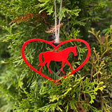 Red metal Horse in a heart ornament with twine hanger.